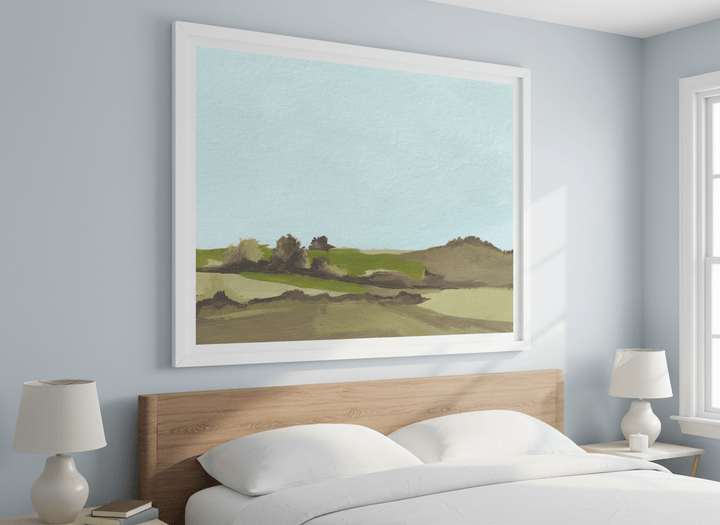 Minimalist artwork displayed in a calm, light-filled bedroom interior