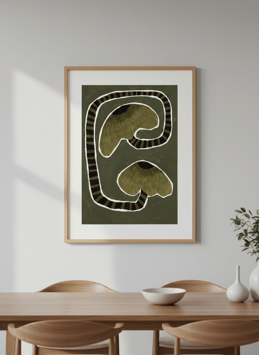 Wall art styled above a dining table in a contemporary home