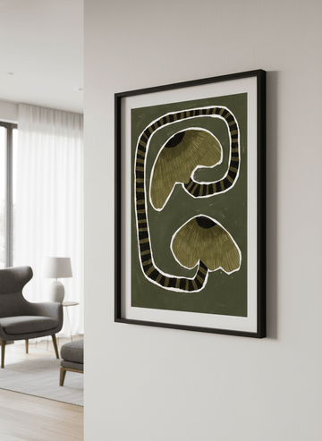 Modern wall art styled above a sofa in a neutral living room