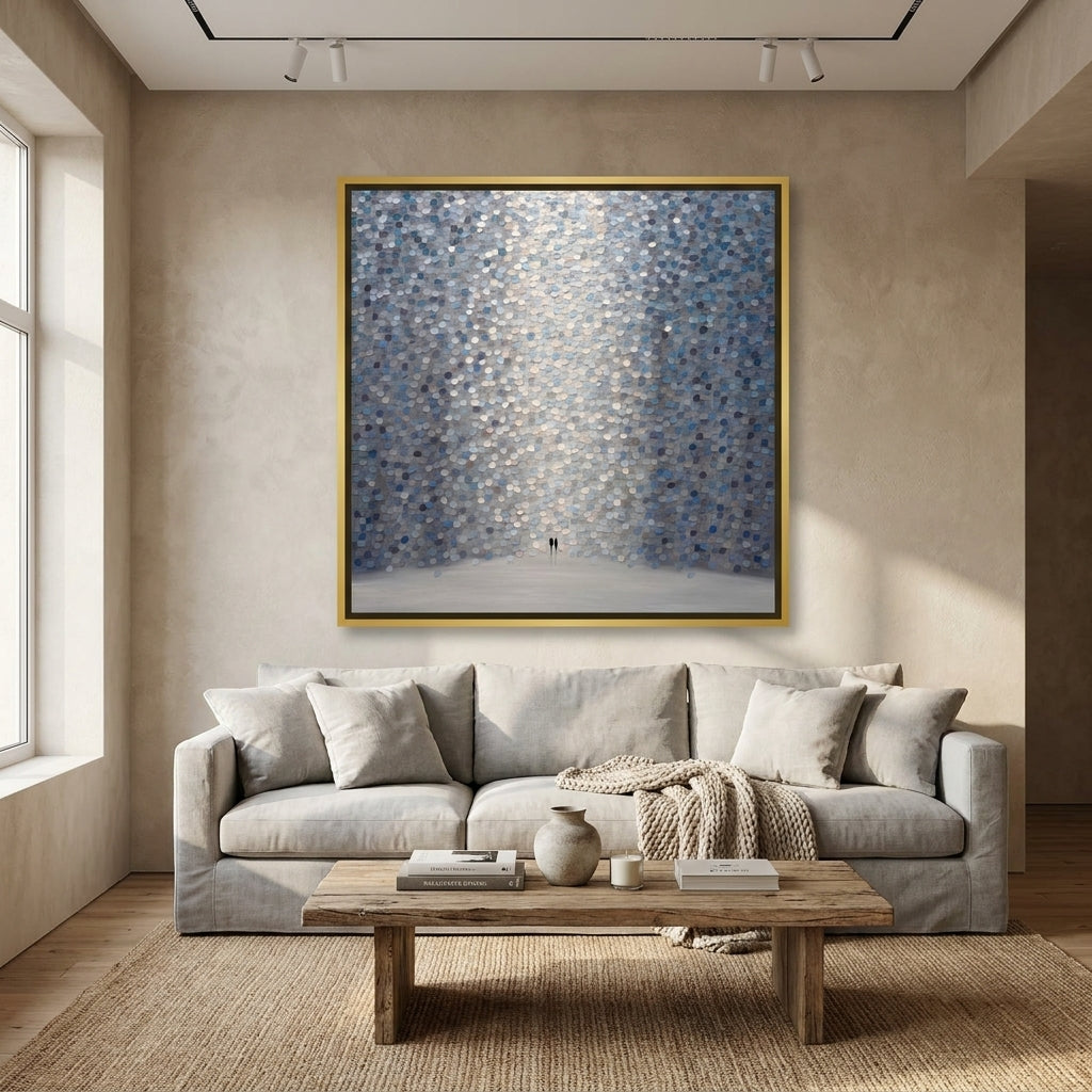 Oversized statement canvas wall art with a gold leaf surround styled in a neutral living room