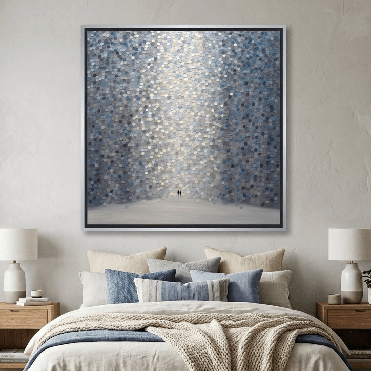 Canvas wall art with a silver leaf surround styled in a calm, light-filled bedroom