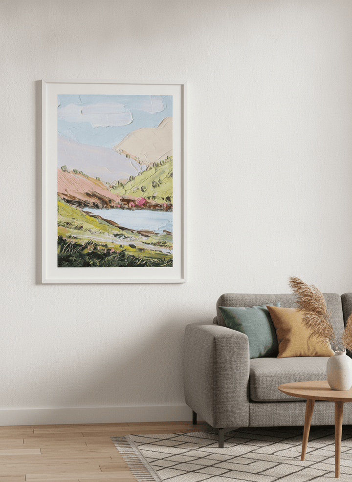 Modern wall art styled above a sofa in a neutral living room