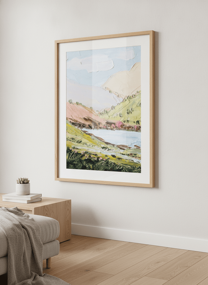 Modern wall art styled above a sofa in a neutral living room