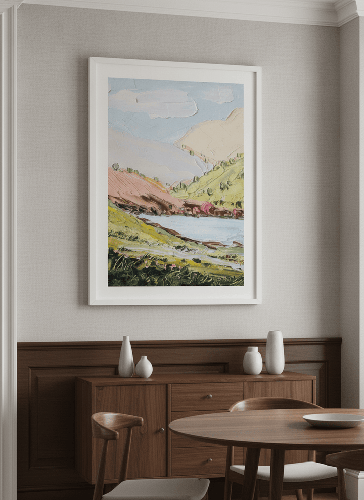 Wall art styled above a dining table in a contemporary home