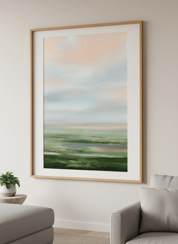 Modern wall art styled above a sofa in a neutral living room