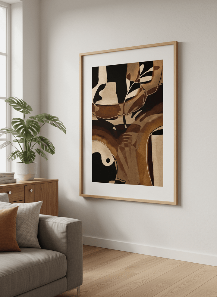 Modern wall art styled above a sofa in a neutral living room