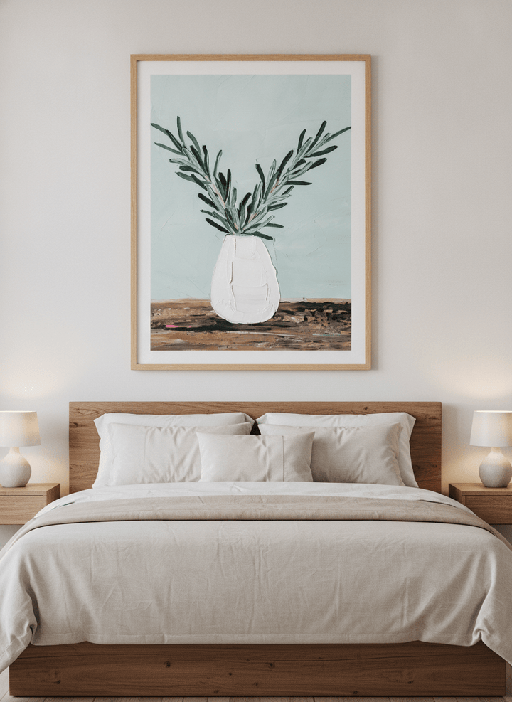 Minimalist artwork displayed in a calm, light-filled bedroom interior