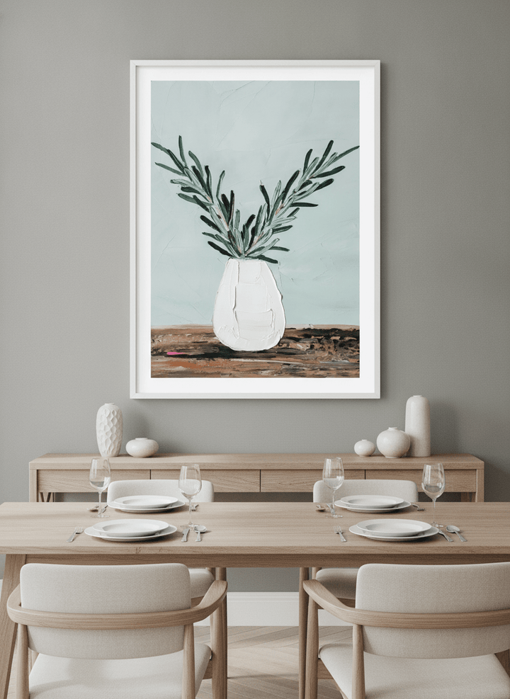Wall art styled above a dining table in a contemporary home