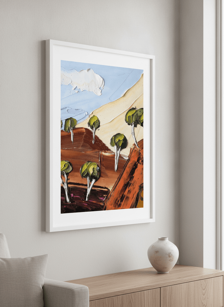 Modern wall art styled above a sofa in a neutral living room