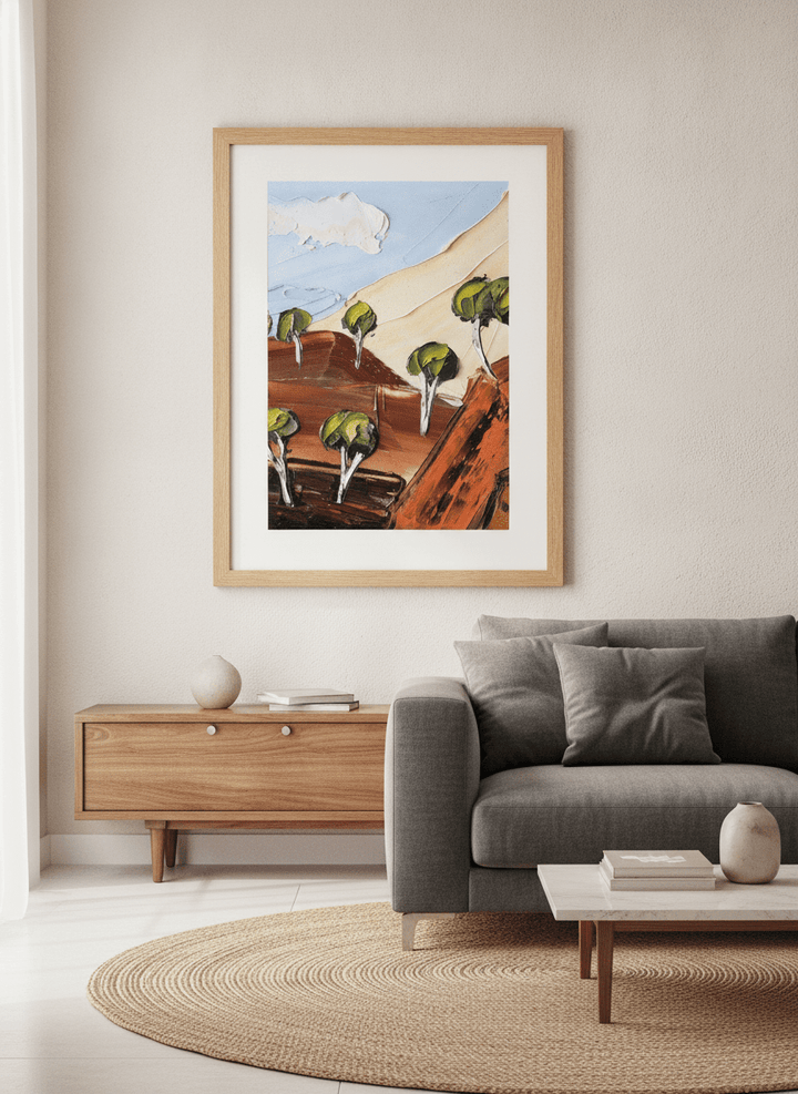 Modern wall art styled above a sofa in a neutral living room