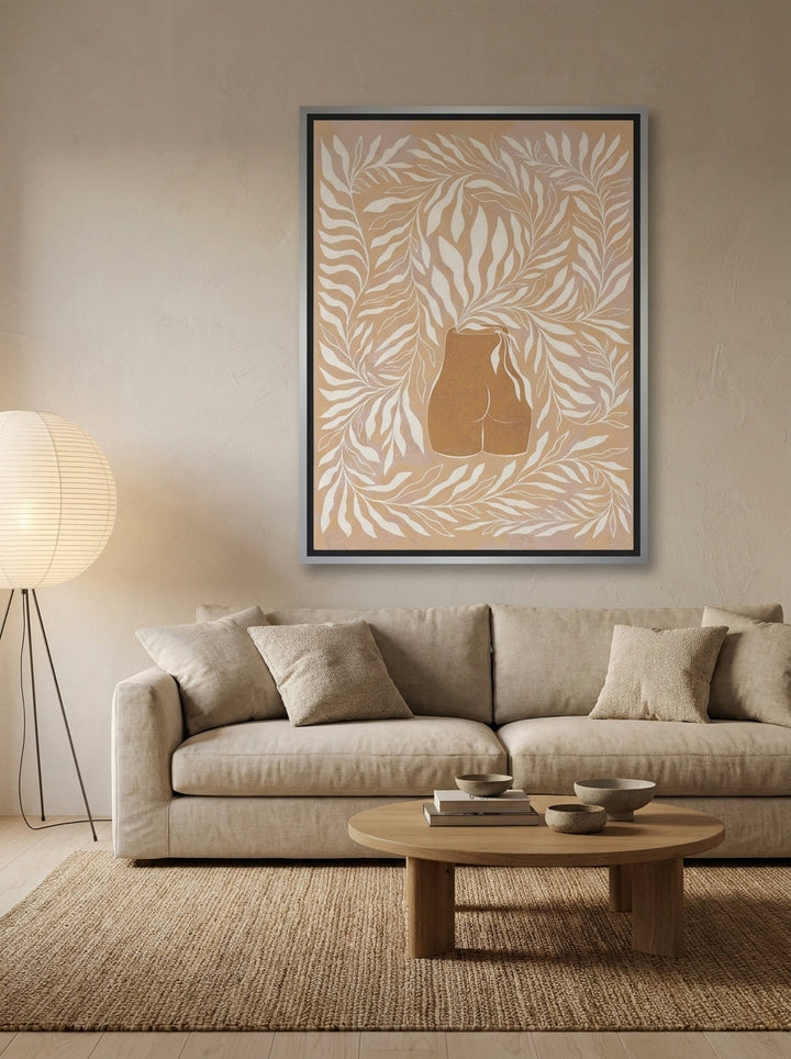 Oversized statement canvas wall art with a silver leaf surround styled on the wall in a warm Japandi living room
