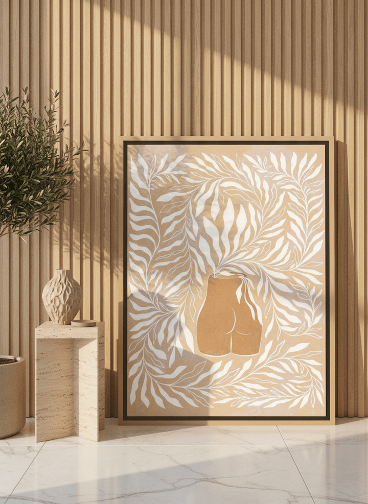 Canvas wall art with a natural timber surround leaning against the wall in a luxe bathroom
