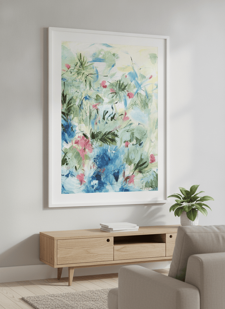 Modern wall art styled above a sofa in a neutral living room