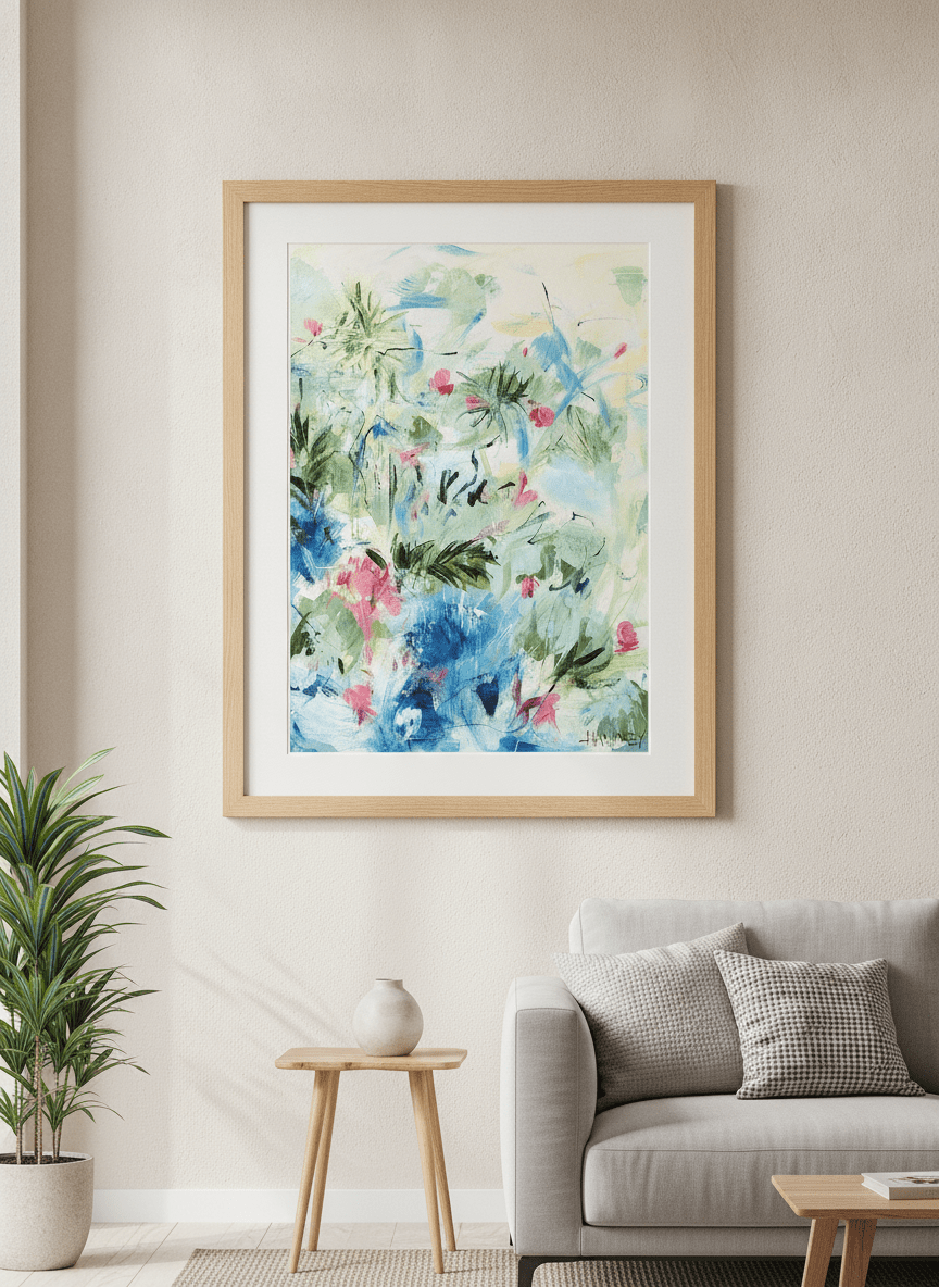 Modern wall art styled above a sofa in a neutral living room