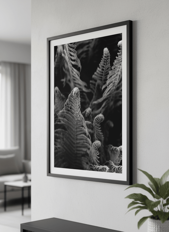 Modern wall art styled above a sofa in a neutral living room