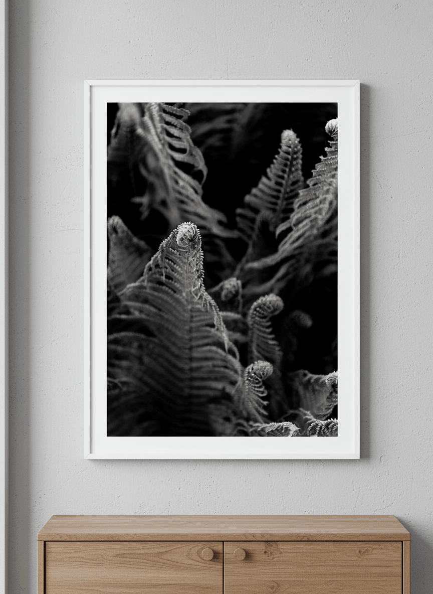 Minimalist artwork displayed in a calm, light-filled bedroom interior
