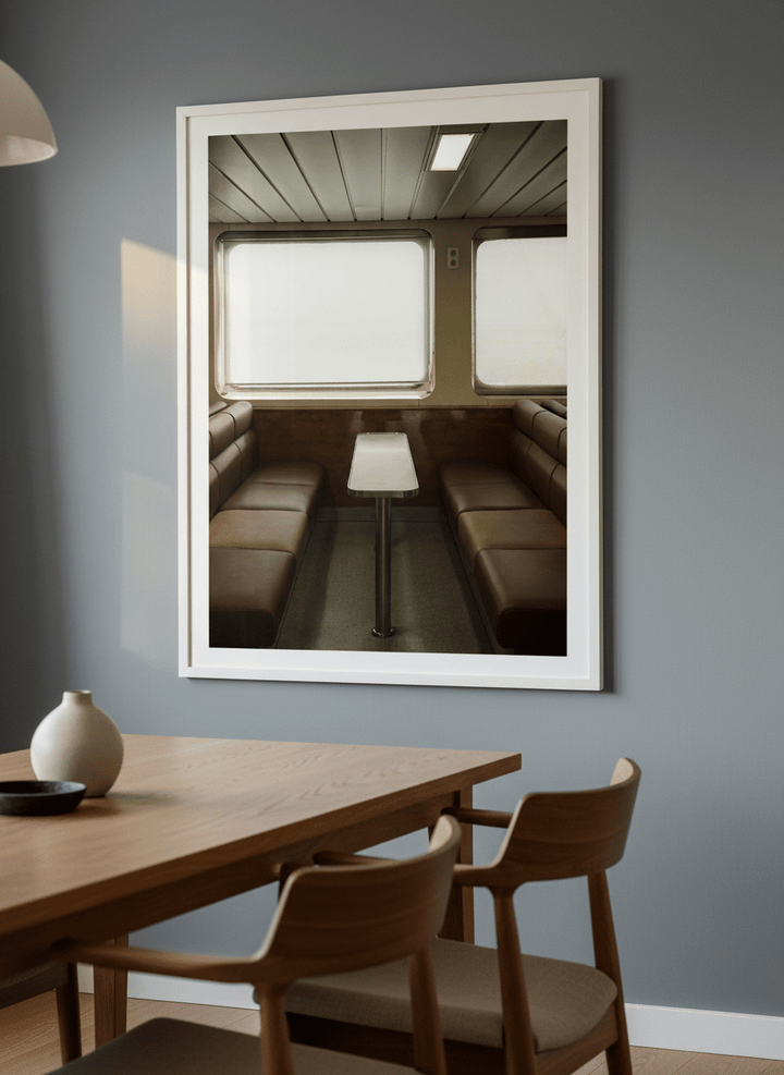 Wall art styled above a dining table in a contemporary home