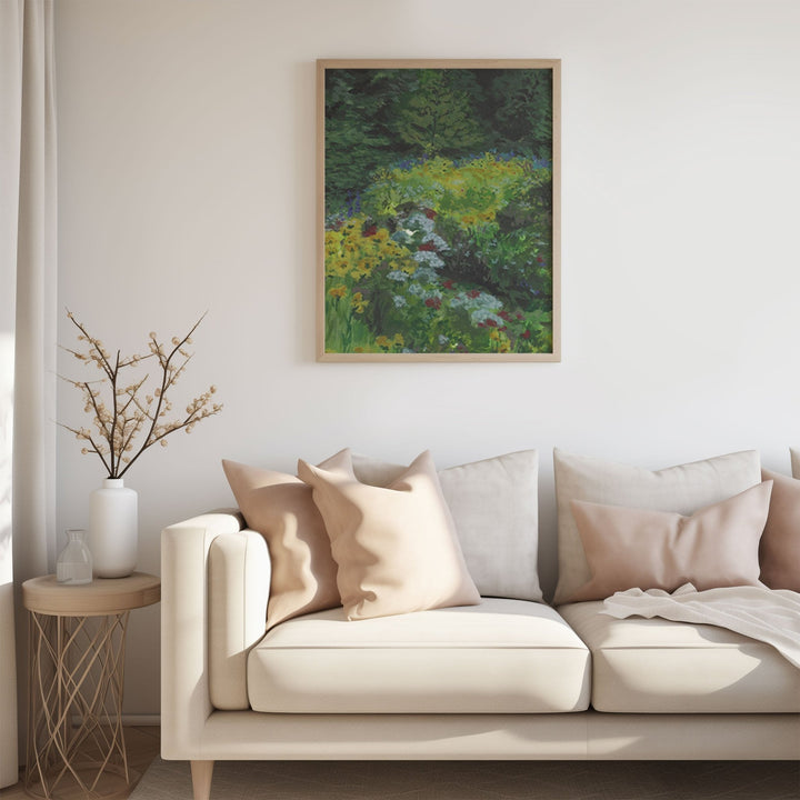 Living room with a beige sofa, decorative pillows, and a painting of a garden.