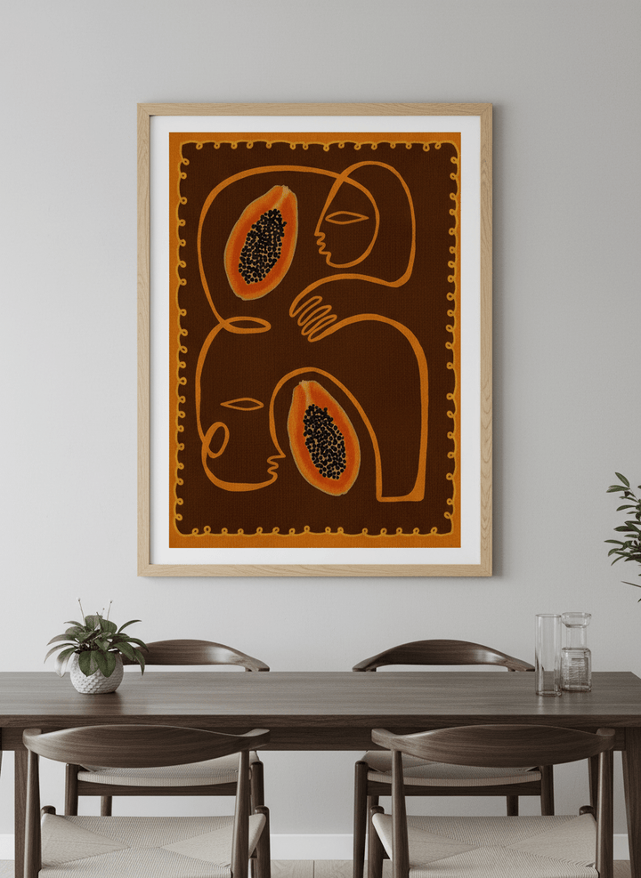 Wall art styled above a dining table in a contemporary home