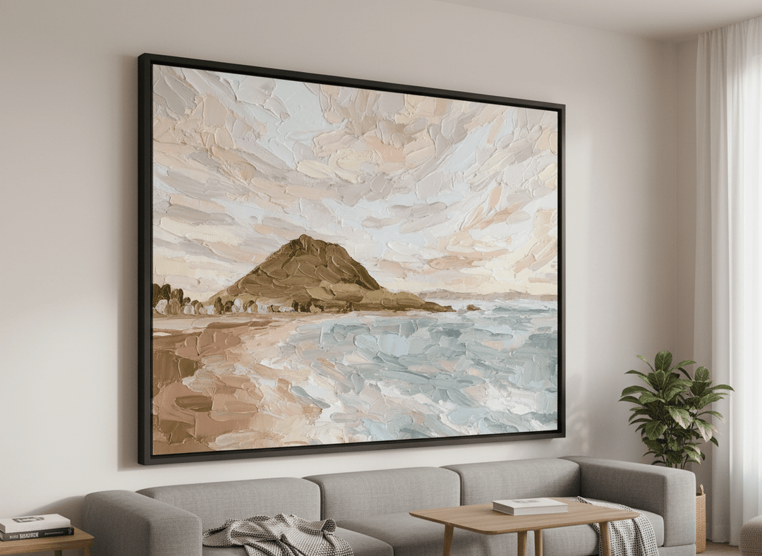 Modern wall art styled above a sofa in a neutral living room