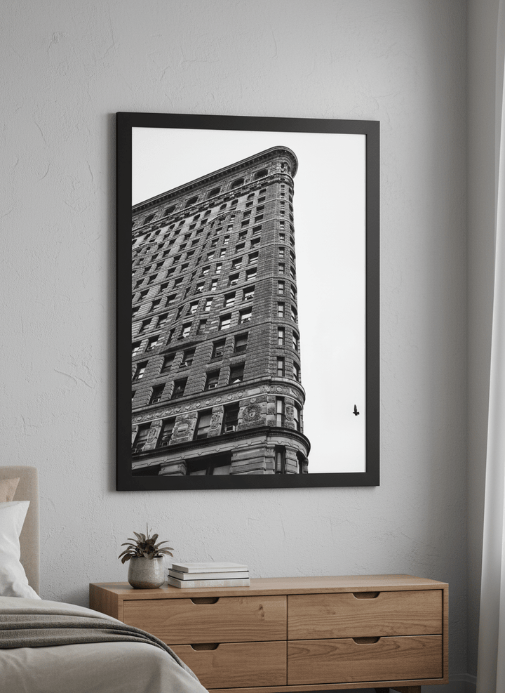 Minimalist artwork displayed in a calm, light-filled bedroom interior