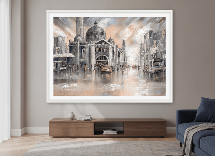 Modern wall art styled above a sofa in a neutral living room