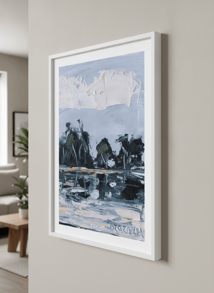 Modern wall art styled above a sofa in a neutral living room