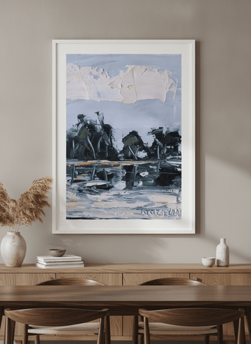 Wall art styled above a dining table in a contemporary home