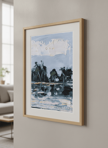 Modern wall art styled above a sofa in a neutral living room