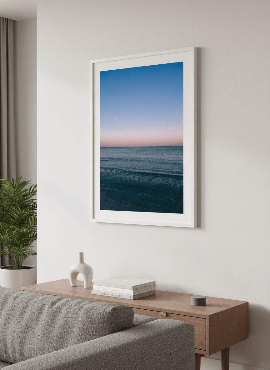 Modern wall art styled above a sofa in a neutral living room
