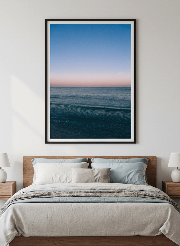Minimalist artwork displayed in a calm, light-filled bedroom interior