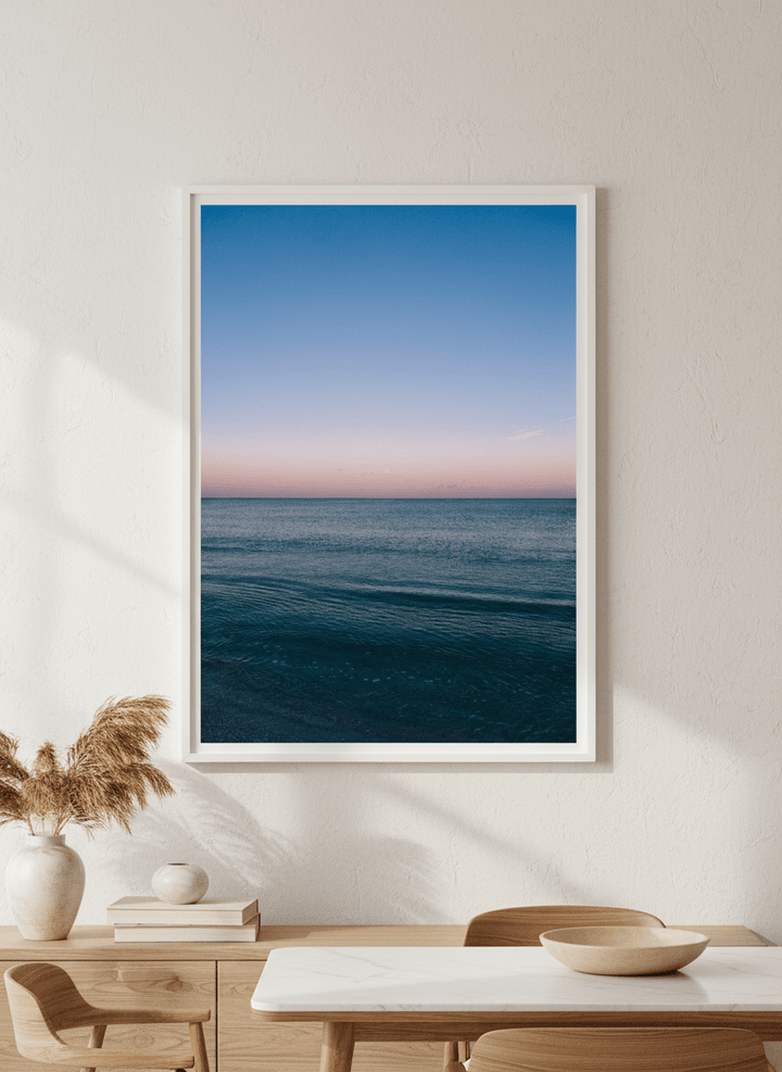 Wall art styled above a dining table in a contemporary home