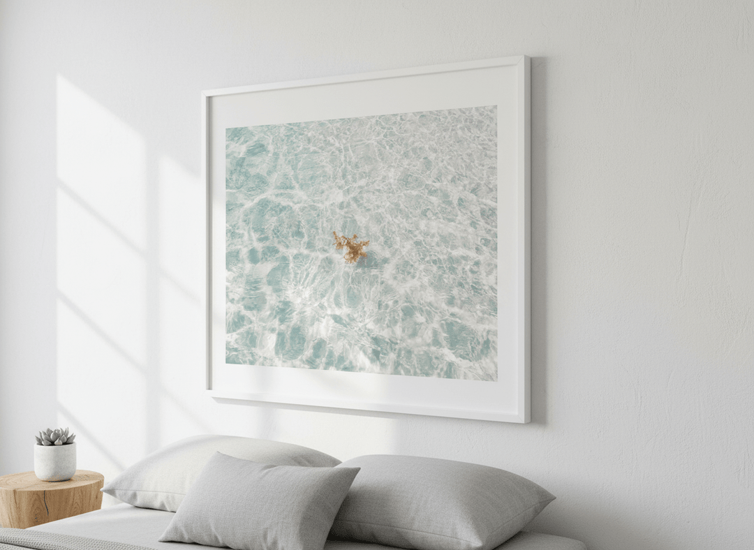Minimalist artwork displayed in a calm, light-filled bedroom interior