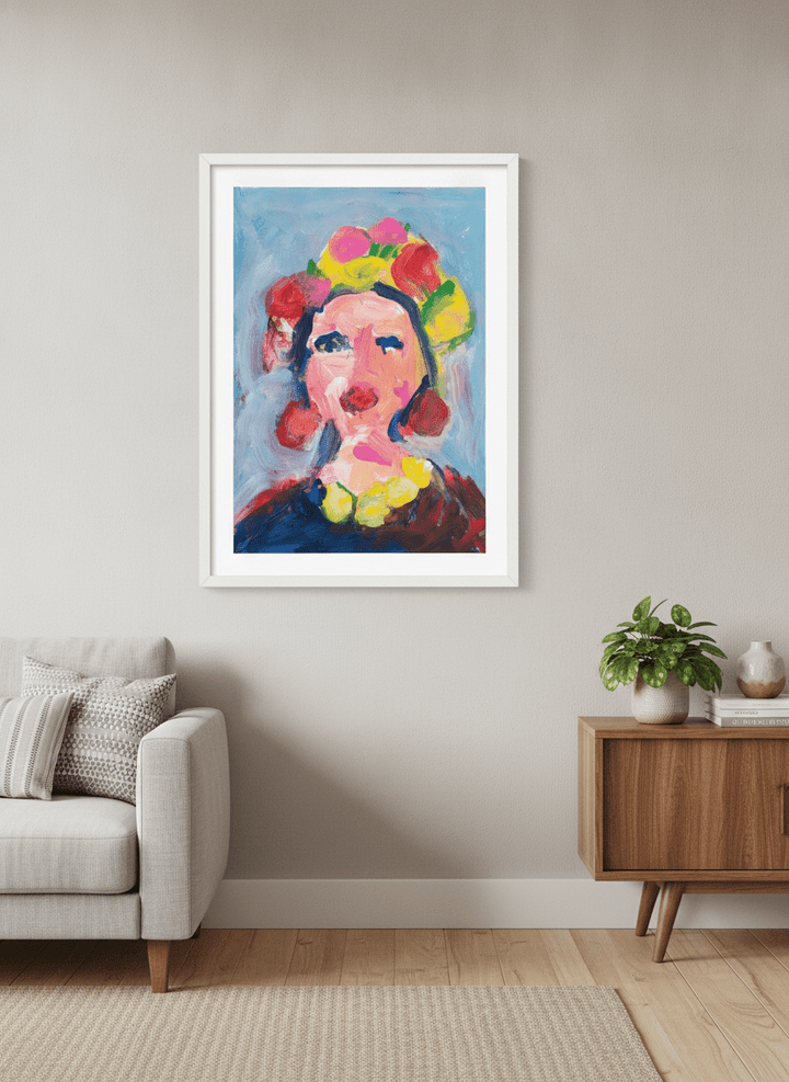 Modern wall art styled above a sofa in a neutral living room