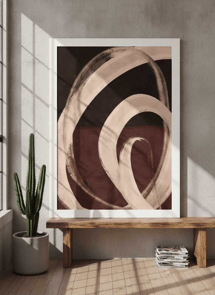 Modern wall art print standing on a bench in an industrial loft bedroom