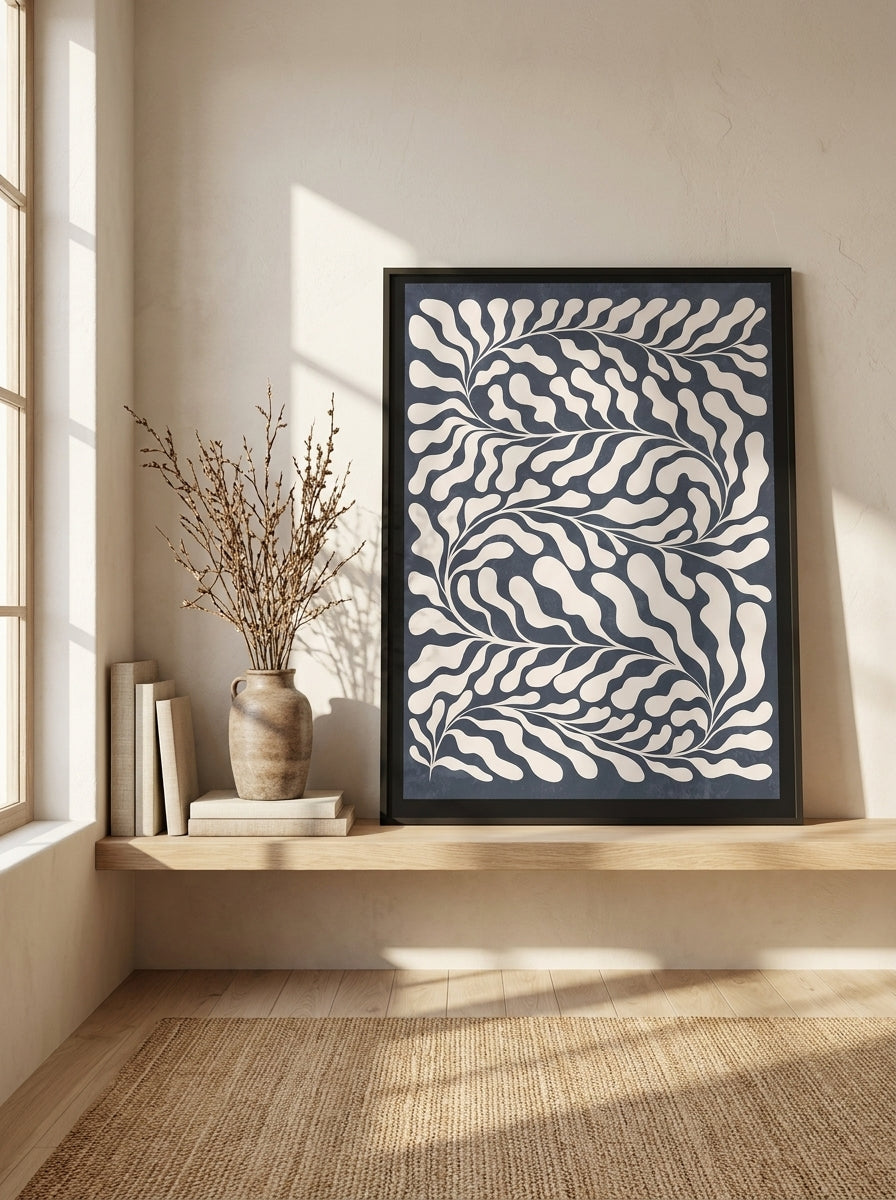 Modern wall art print standing on a shelf in a warm Japandi bedroom