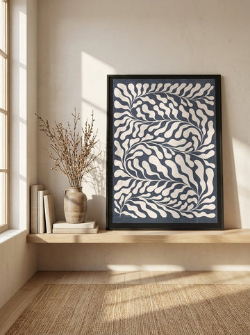 Modern wall art print standing on a shelf in a warm Japandi bedroom