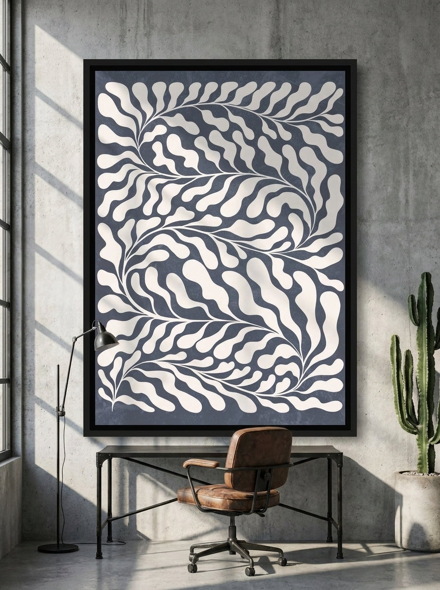 Canvas wall art with a black surround styled on the wall in an industrial loft home office