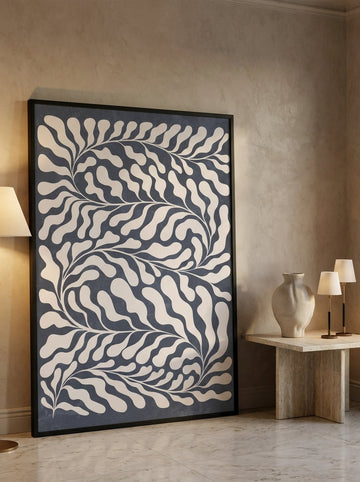 Oversized statement modern wall art print leaning against the wall in a luxe dining room