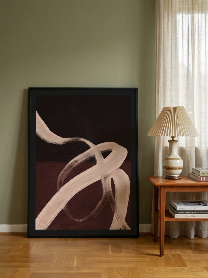 Modern wall art print leaning against the wall in a mid-century living room