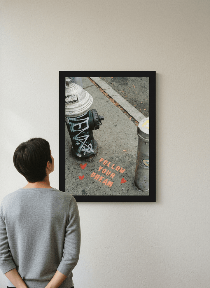 Person showcasing the artwork against a clean modern interior wall