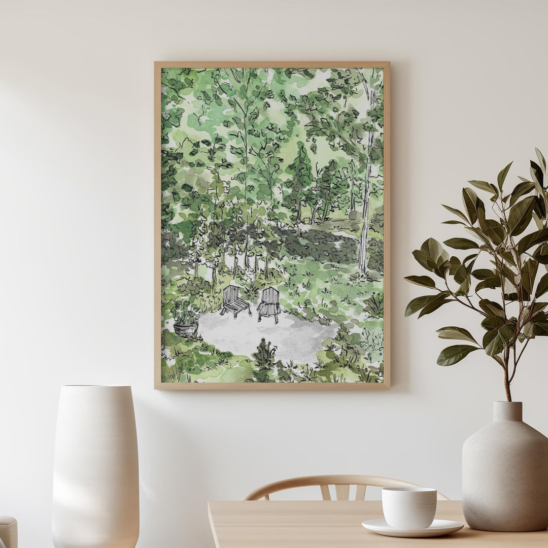 Artwork of a garden scene on a wall above a table with decor items.