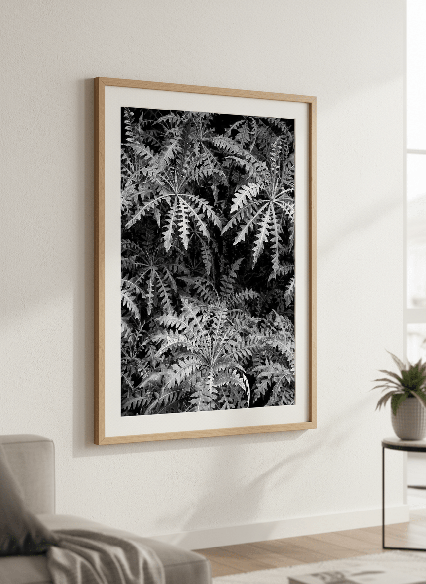 Modern wall art styled above a sofa in a neutral living room