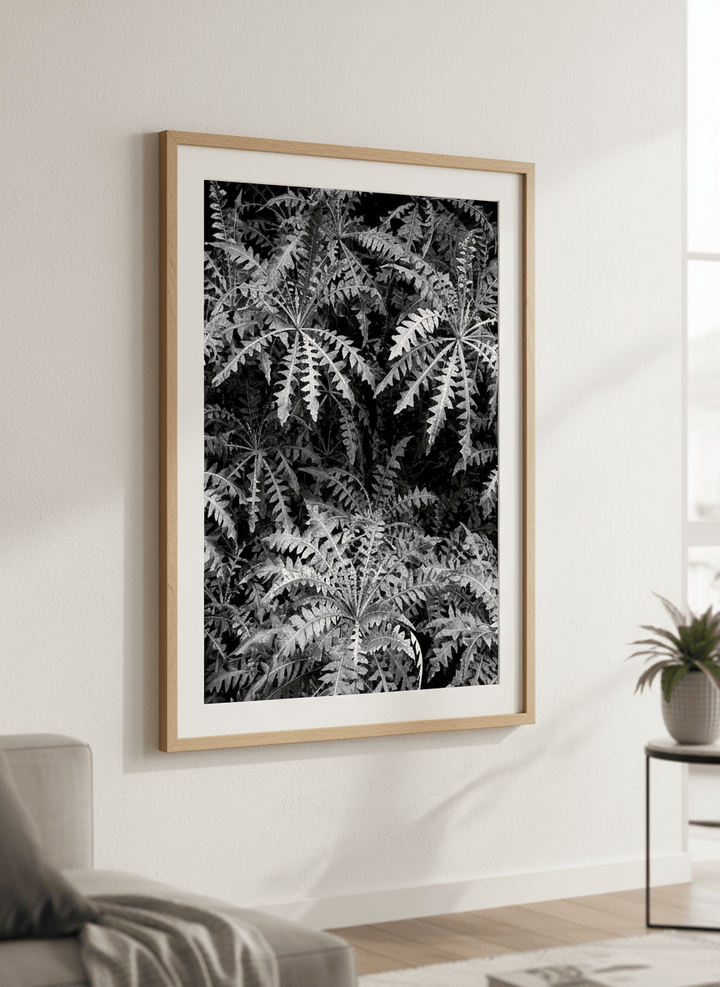 Modern wall art styled above a sofa in a neutral living room