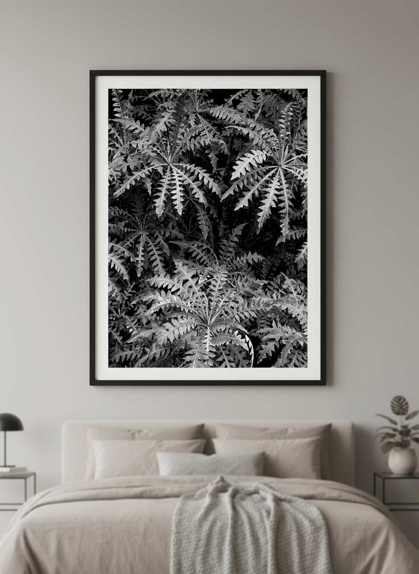 Minimalist artwork displayed in a calm, light-filled bedroom interior