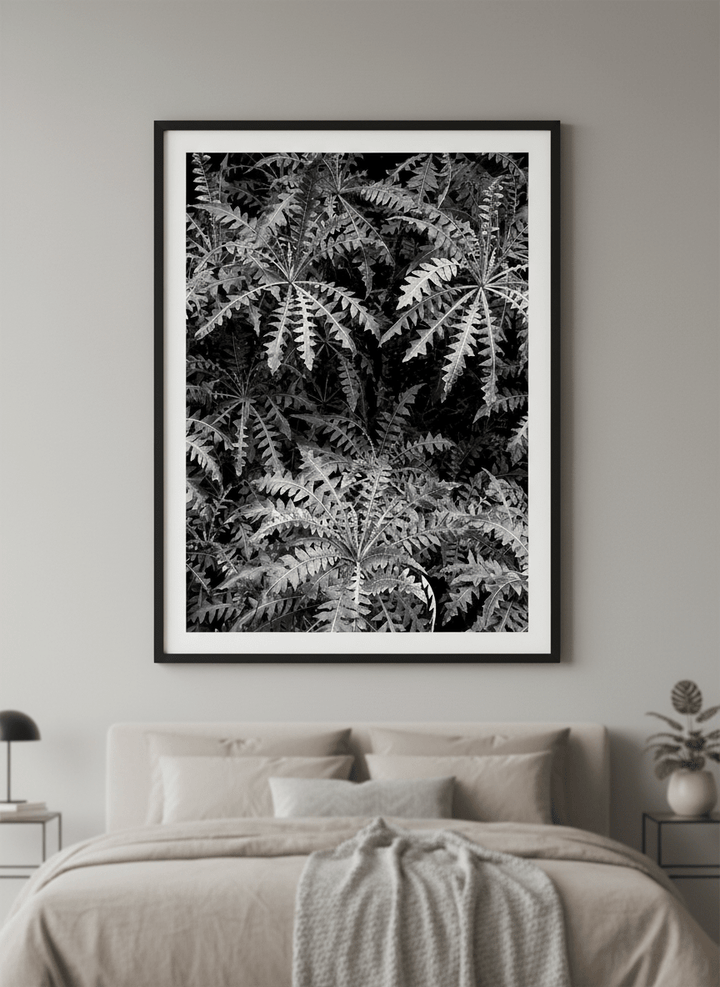 Minimalist artwork displayed in a calm, light-filled bedroom interior
