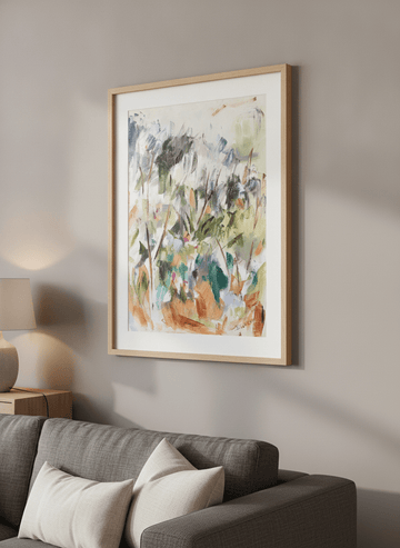 Modern wall art styled above a sofa in a neutral living room