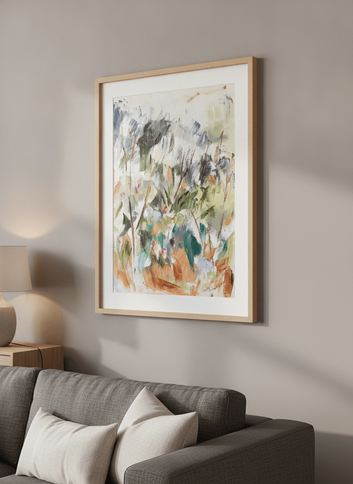 Modern wall art styled above a sofa in a neutral living room