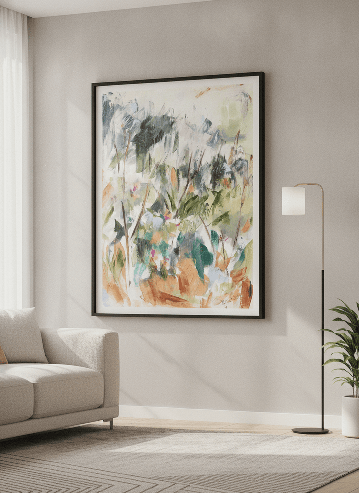 Modern wall art styled above a sofa in a neutral living room