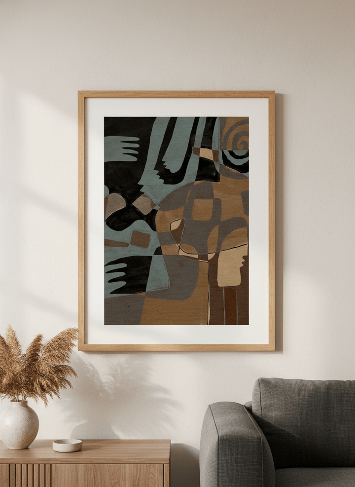 Modern wall art styled above a sofa in a neutral living room